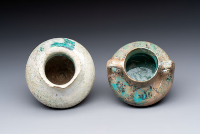 Two Raqqa turquoise-glazed pottery jars with black design, Syria, 12/13th C.