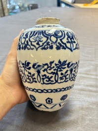 Three Chinese blue and white vases, one with wooden cover, Kangxi