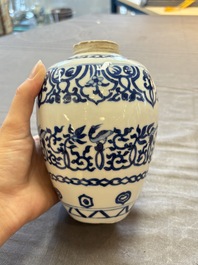 Three Chinese blue and white vases, one with wooden cover, Kangxi