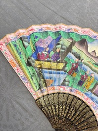 Two Chinese Canton gilt-lacquered and painted paper fans, one with its original box, 19th C.