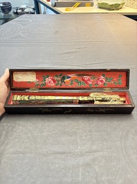 A Chinese Canton gilt-lacquered and painted paper fan with its original box, 19th C.