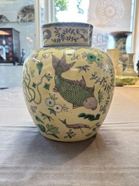 A pair of Chinese verte biscuit 'fish' jars and covers, 19th C.