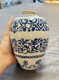 Three Chinese blue and white vases, one with wooden cover, Kangxi