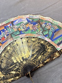 Two Chinese Canton gilt-lacquered and painted paper fans, one with its original box, 19th C.