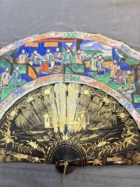 Two Chinese Canton gilt-lacquered and painted paper fans, one with its original box, 19th C.