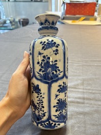 Three Chinese blue and white vases, one with wooden cover, Kangxi