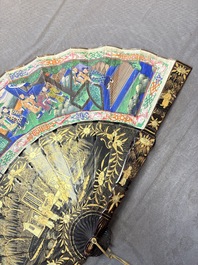 Two Chinese Canton gilt-lacquered and painted paper fans, one with its original box, 19th C.