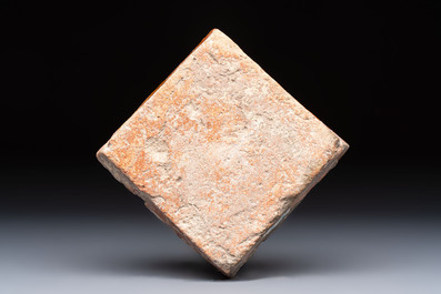 A medieval slip-decorated &lsquo;Fleur-de-Lys&rsquo; tile, probably France or Flanders, 14th C.