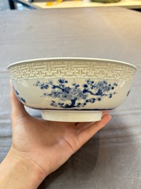 A pair of Chinese blue and white relief-border 'Lan Caihe' bowls, Kangxi