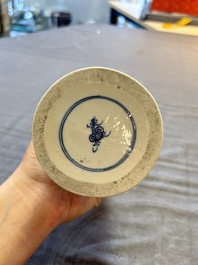 Three Chinese blue and white vases, one with wooden cover, Kangxi