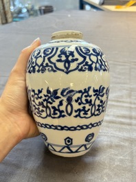 Three Chinese blue and white vases, one with wooden cover, Kangxi