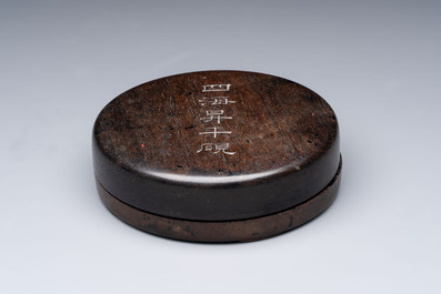 A Chinese carved circular Duan inkstone in a zitan box, signed Dong Jiaozeng 董教增, 18/19th C.