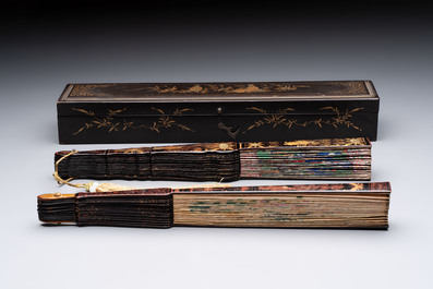 Two Chinese Canton gilt-lacquered and painted paper fans, one with its original box, 19th C.