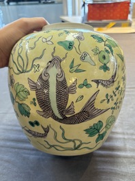 A pair of Chinese verte biscuit 'fish' jars and covers, 19th C.
