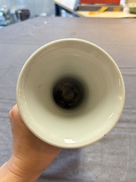Three Chinese blue and white vases, one with wooden cover, Kangxi