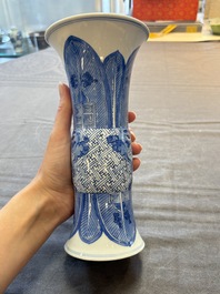 Three Chinese blue and white vases, one with wooden cover, Kangxi