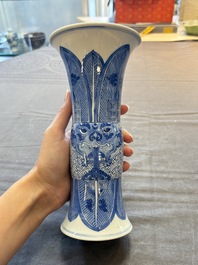 Three Chinese blue and white vases, one with wooden cover, Kangxi