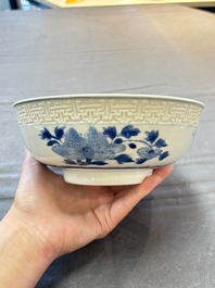 A pair of Chinese blue and white relief-border 'Lan Caihe' bowls, Kangxi