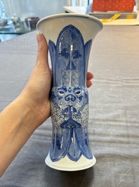 Three Chinese blue and white vases, one with wooden cover, Kangxi