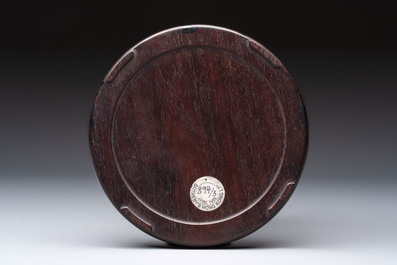 A Chinese carved circular Duan inkstone in a zitan box, signed Dong Jiaozeng 董教增, 18/19th C.