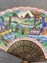 Two Chinese Canton gilt-lacquered and painted paper fans, one with its original box, 19th C.