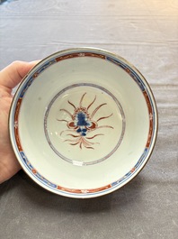 Seven Chinese Imari-style and famille rose bowls with floral and figural designs, 18th C.