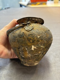 A rare Chinese parcel-gilt silver handled jar with floral scroll design, Tang