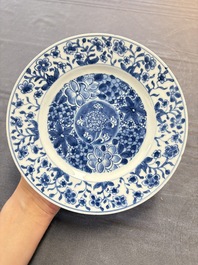 12 Chinese blue and white plates with figural and floral design, 18th C.