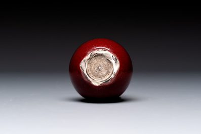 A Chinese copper-red-glazed plate, a meiping vase and two water pots, Kangxi marks, 19/20th C.