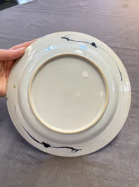 12 Chinese blue and white plates with figural and floral design, 18th C.