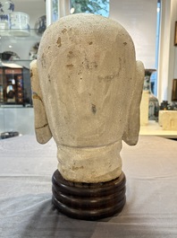 A Chinese stucco head of a Luohan, Qing
