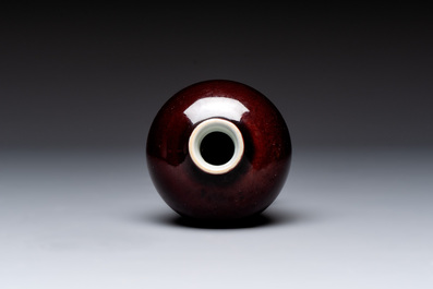 A Chinese copper-red-glazed plate, a meiping vase and two water pots, Kangxi marks, 19/20th C.