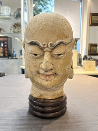 A Chinese stucco head of a Luohan, Qing