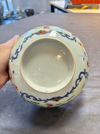 Seven Chinese Imari-style and famille rose bowls with floral and figural designs, 18th C.