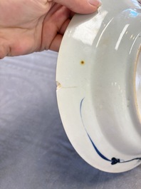 12 Chinese blue and white plates with figural and floral design, 18th C.