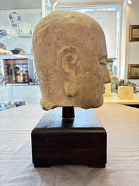 A Chinese sandstone head of a Luohan, early Qing