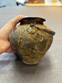 A rare Chinese parcel-gilt silver handled jar with floral scroll design, Tang