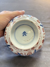 Seven Chinese Imari-style and famille rose bowls with floral and figural designs, 18th C.