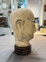A Chinese stucco head of a Luohan, Qing