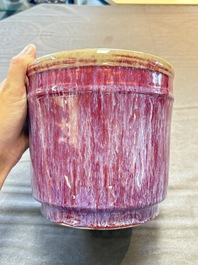 A Chinese flamb&eacute;-glazed cylindrical jardini&egrave;re and two celadon-glazed vases, 19th C.