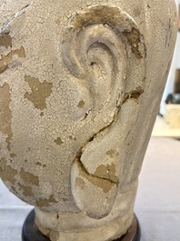 A Chinese stucco head of a Luohan, Qing