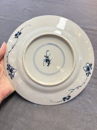 12 Chinese blue and white plates with figural and floral design, 18th C.