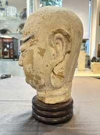A Chinese stucco head of a Luohan, Qing