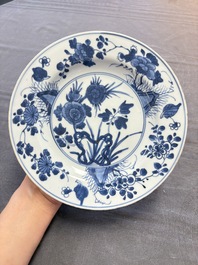 12 Chinese blue and white plates with figural and floral design, 18th C.