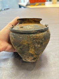 A rare Chinese parcel-gilt silver handled jar with floral scroll design, Tang