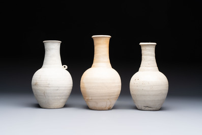 Three cream-glazed bottle vases and two jarlets from the Jepara shipwreck, Dehua or Anxi kilns, Song