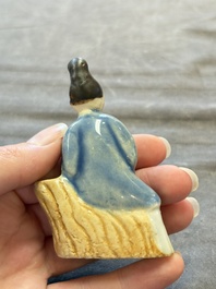 Nine Chinese blue, white, celadon-glazed and famille rose figures, 18/19th C.