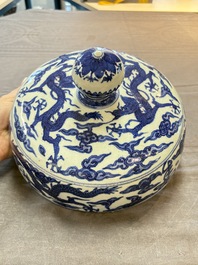 A Chinese blue and white 'dragon among clouds' cover, 20th C.