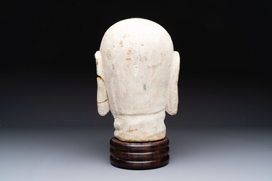 A Chinese stucco head of a Luohan, Qing
