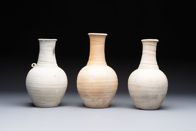 Three cream-glazed bottle vases and two jarlets from the Jepara shipwreck, Dehua or Anxi kilns, Song